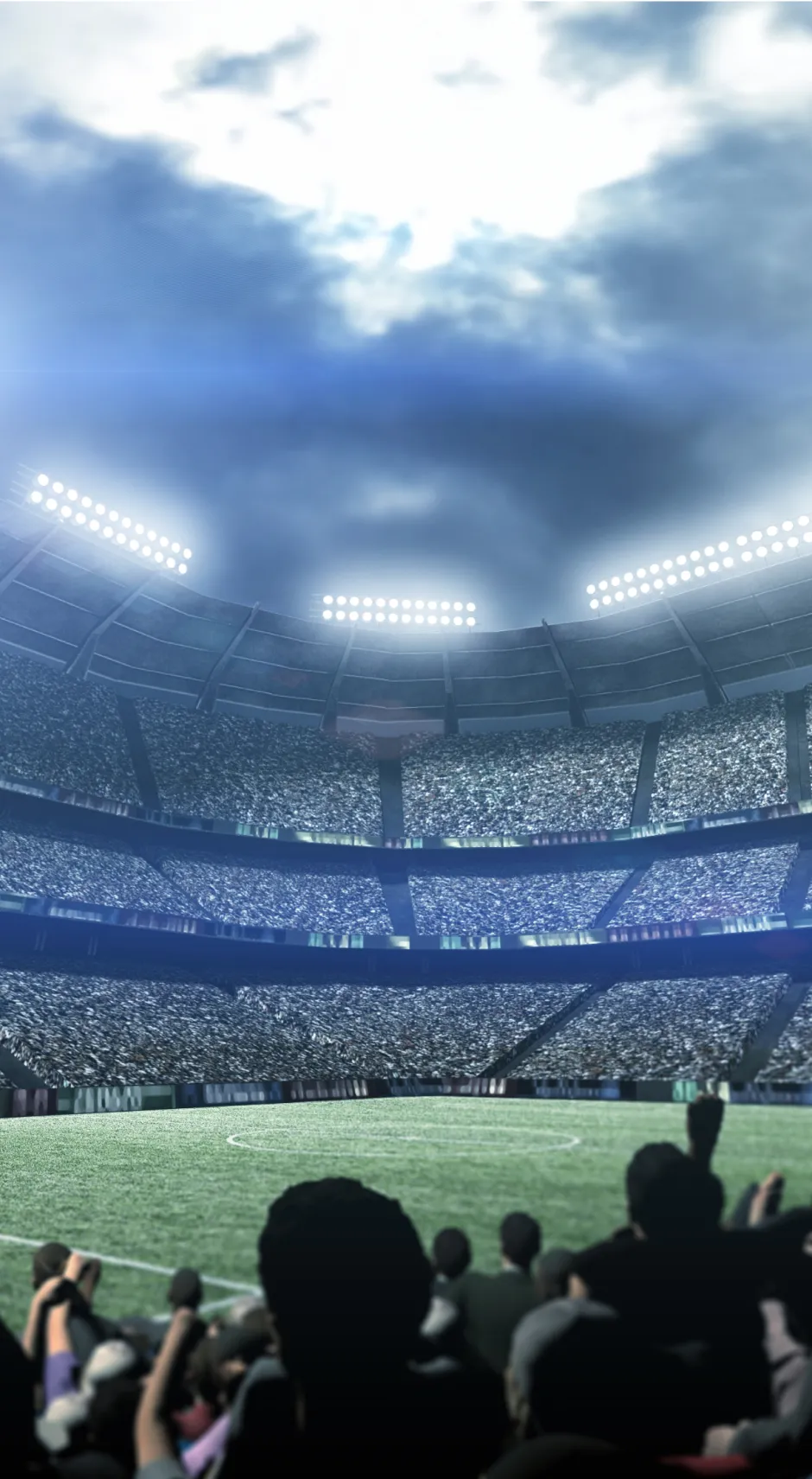 View from a seat in a stadium, showing spectators in the stands.